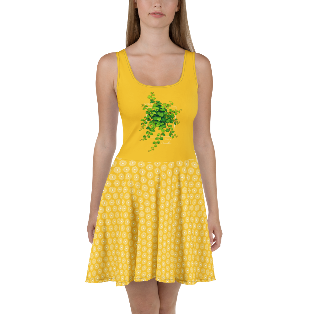 Robe d'été jaune évasée style "skater dress" avec imprimé botanique vert et bas à motifs géométriques blancs.